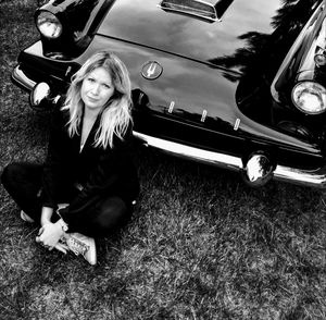 Portrait of smiling woman sitting in car