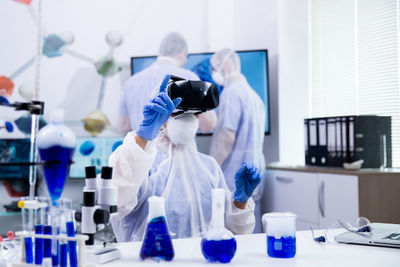 Rear view of scientist working in laboratory