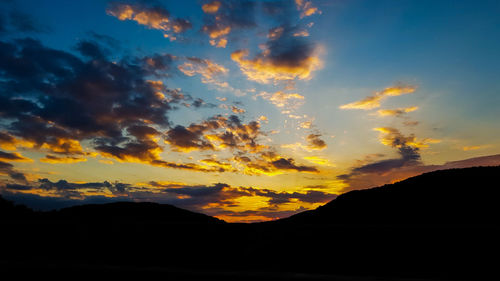 Scenic view of dramatic sky during sunset