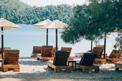 Empty chairs and tables at beach