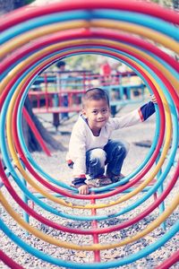 Full length portrait of boy playing in playground