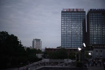 Modern buildings against sky in city