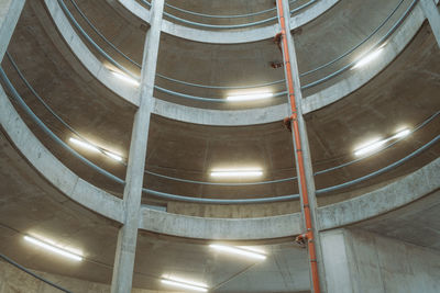 Low angle view of illuminated lights on ceiling