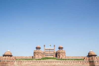 India travel tourism background - in front of red fort in, delhi - world heritage site. delhi, india