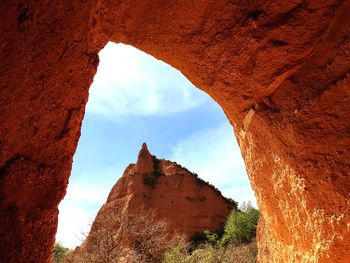 Low angle view of rock formation against sky