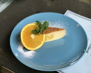 High angle view of fruit in plate on table