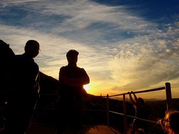 Silhouette of man against sky at sunset