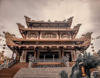 Low angle view of temple building against sky
