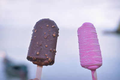 Close-up of ice creams against sky