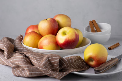 Close-up of apples in plate on table