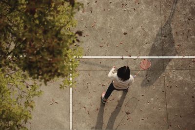 High angle view of girl playing badminton