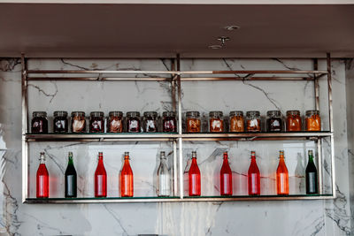 Bottles and jars arranged in shelf