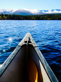 Cropped image of boat over lake