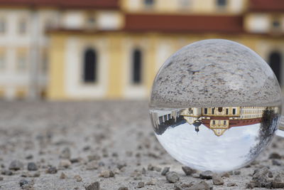 Close-up of crystal ball on land