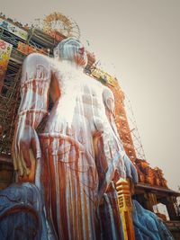 Low angle view of statue against building