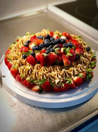 High angle view of strawberries in plate on table