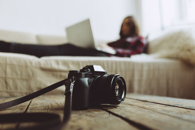 Close-up of camera on table at home