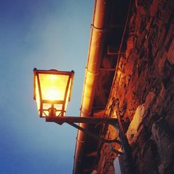 Low angle view of illuminated lamp post