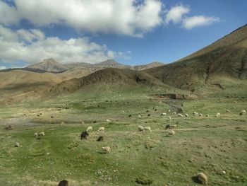 Scenic view of mountains against cloudy sky