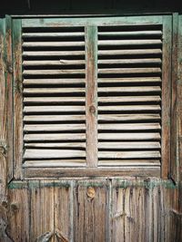 Full frame shot of weathered wooden window