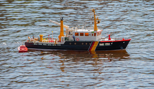 Remote controlled ship model is remote controlled on a lake