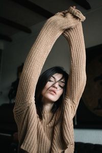 Young woman wearing beige