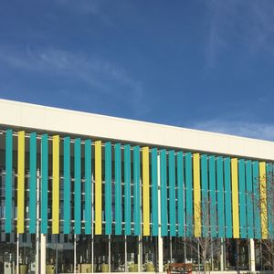 Multi colored built structure against blue sky