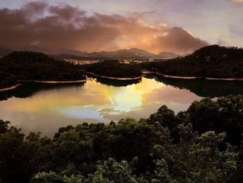 Scenic view of lake against cloudy sky