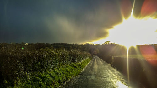 Scenic view of farm against sky