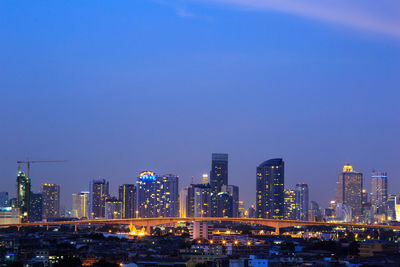 Illuminated buildings in city at night