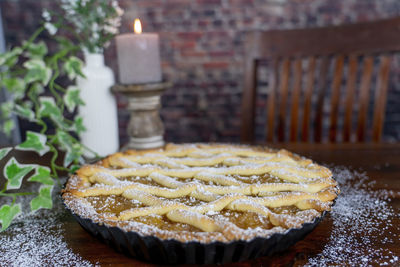 Delicious apple pie on wood table background.