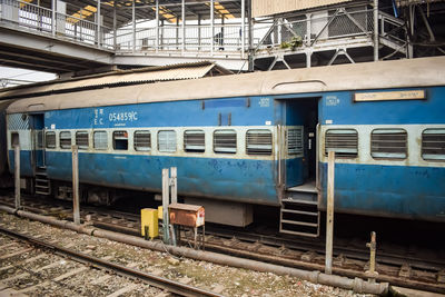 Indian railway train at amritsar railway station platform during morning time, colourful train