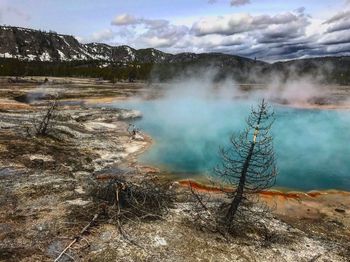Scenic view of frozen lake against sky