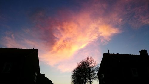 High section of building against sky at sunset