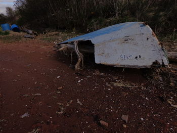 Abandoned car on field