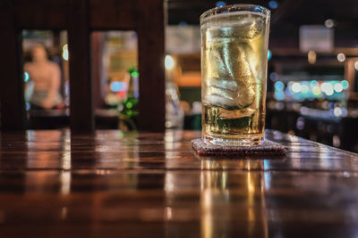 Close-up of beer glass on table