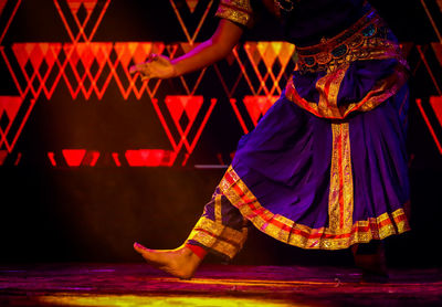 Low section of woman dancing on stage