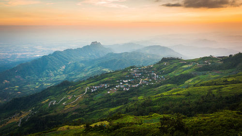 Scenic view of mountains against sky during sunset