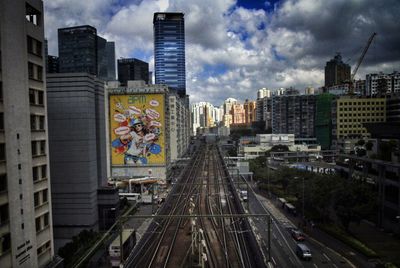 Panoramic view of city street and buildings against sky