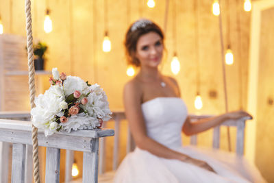 Flower bouquet with bride in background