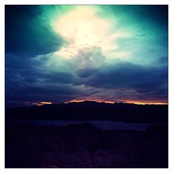 Scenic view of landscape against cloudy sky