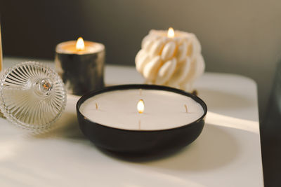 Burning candles on table indoors. cozy home