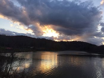 Scenic view of lake against sky during sunset