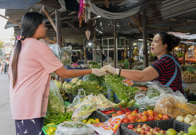 Woman at market stall