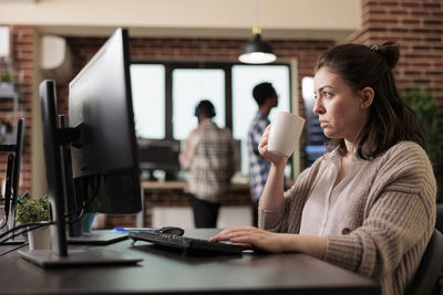 Businesswoman working at desk in office