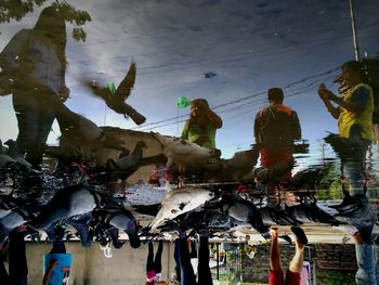 People on street against sky