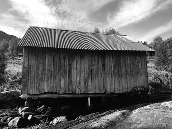 View of house against cloudy sky