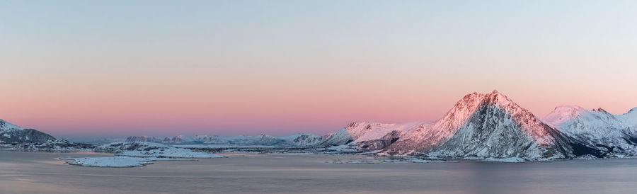 Scenic view of sea against clear sky during sunset