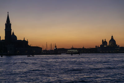 Sunset in venice italy, san giorgio maggiore island and church, giudecca canal and salute basilica