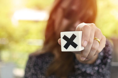 Close-up of woman holding umbrella
